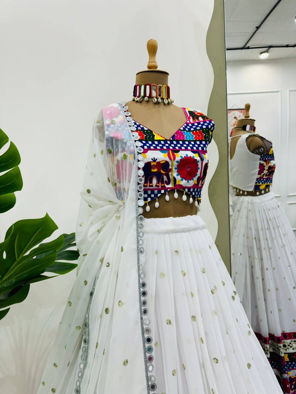 Exquisite Pristine White Designer Lehenga Choli with Vibrant Multicolored Traditional Elephant Embroidery and Mirror Work Detailing